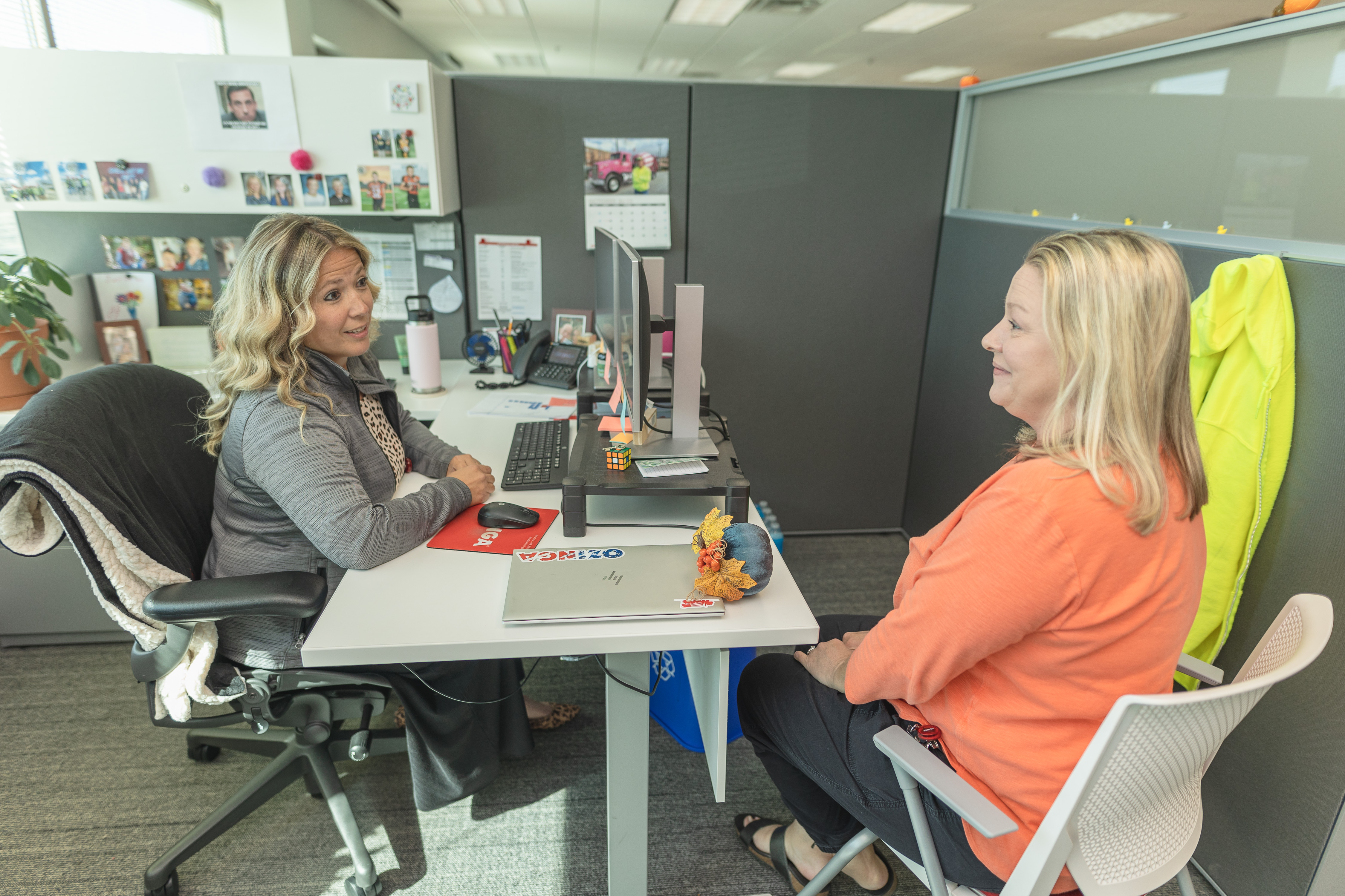 Ozinga HR Compliance Supervisor Mary Kate Burns speaks with Benefits Manager Chris Blumpka at Ozinga's corporate office in Mokena on Oct. 3, 2023. Ozinga HR Compliance Supervisor Mary Kate Burns speaks with Benefits Manager Chris Blumpka at Ozinga's corporate office in Mokena on Oct. 3, 2023.