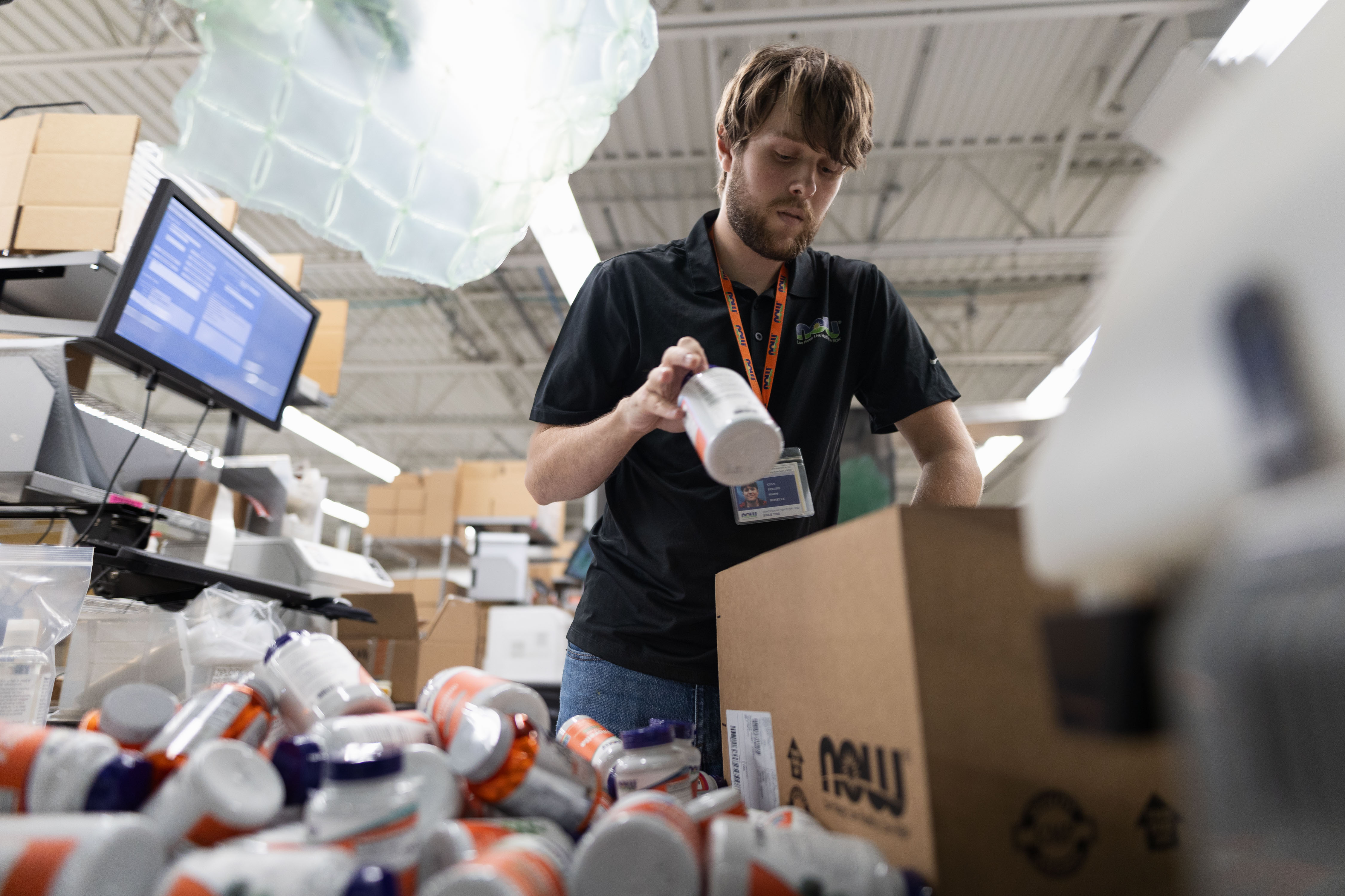 NOW Health Group employee Gian Polito packs an order at his work station inside of NOW's RSL Distribution Location in Roselle on Sept. 14, 2023. NOW Health Group employee Gian Polito packs an order at his work station inside of NOW's RSL Distribution Location in Roselle on Sept. 14, 2023.